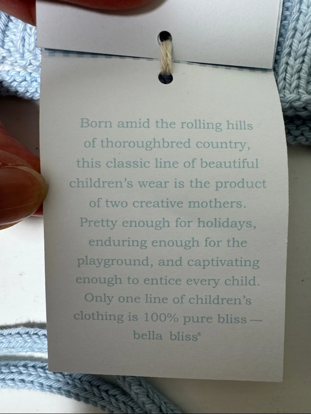 NWT Bella Bliss blue and white cotton child’s hat with ear flaps and ties.